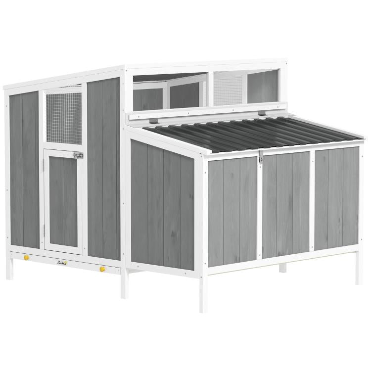 Wooden outdoor chicken coop with gray panel walls, white frame, and ventilated openings