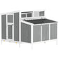 White and gray wooden chicken coop with wire mesh panels and nesting box