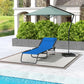 Blue folding chaise lounge pool chair on a patio with reclining mesh back