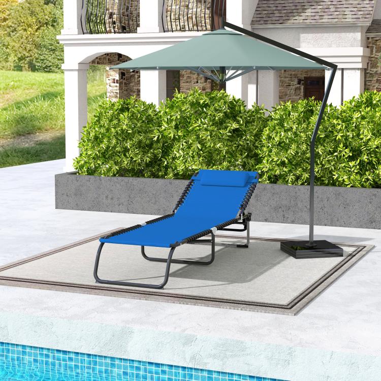 Blue folding chaise lounge pool chair on a patio with reclining mesh back