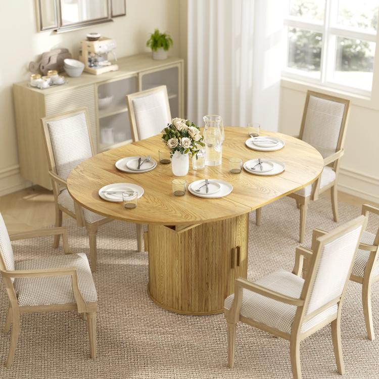 Natural wood round dining table with fluted sliding doors and two-tier storage shelf