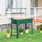Green raised garden bed with greenhouse cover and four legs, with potted flowers