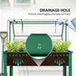 Green raised bed with greenhouse cover showing drainage hole for plant soil