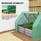 Green galvanized raised garden bed with mini greenhouse cover, plants inside