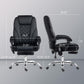 Black massage office chair with size guide lines; padded backrest and height-adjust base.