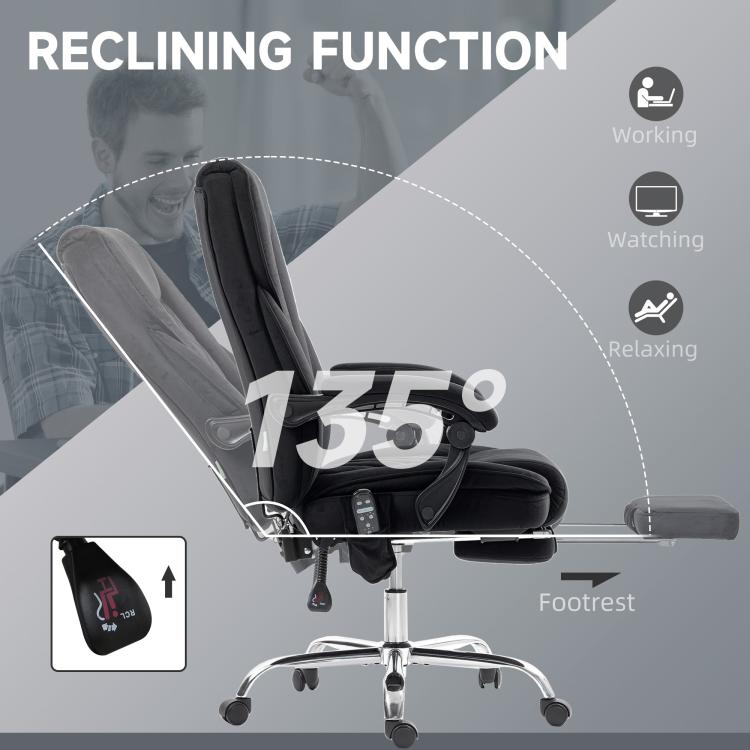 Black reclining massage office chair with attached footrest and control panel on side.