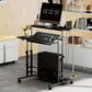 Black standing desk with monitor setup, tilting keyboard tray, and enclosed lower storage.