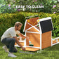 Wooden dog house with openable top and removable floor panel, arched door and porch