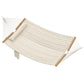 Cream hammock with attached pillow and pad, rope suspension and wooden end spreaders