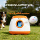 Automatic dog ball launcher in orange and white with speckled ball and dog on grass