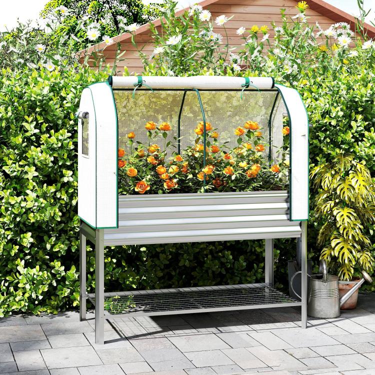 Silver raised garden bed with green greenhouse cover, open front access