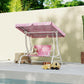 Qaba kids porch swing bench with pink unicorn canopy and seat cushion on patio