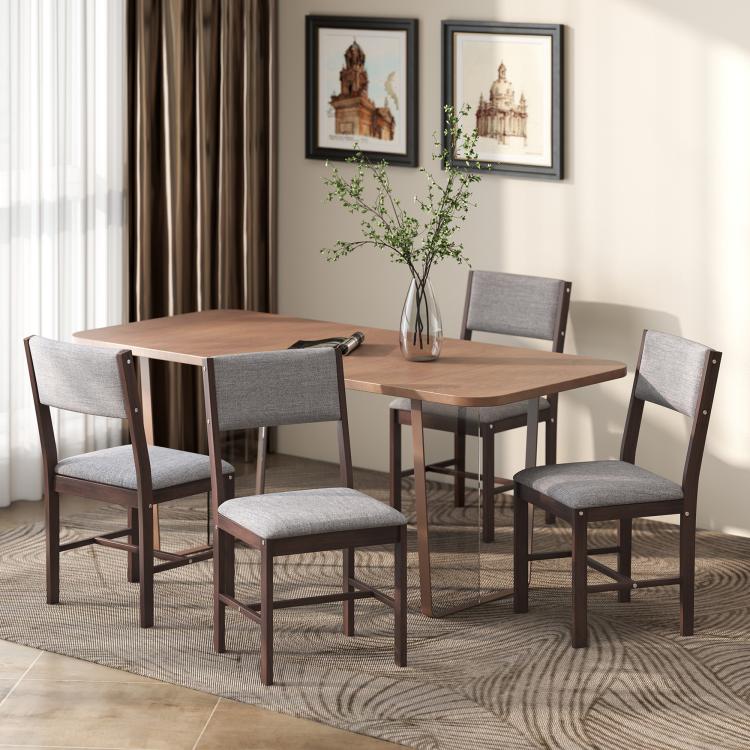 Dining chairs with gray upholstered seats and dark wood legs around table