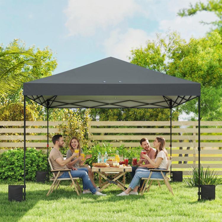 Dark gray pop-up canopy tent with open sides and slanted roof, supported by metal poles