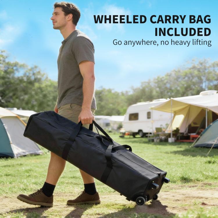 Wheeled carry bag for dark gray pop-up canopy tent, outdoors with man holding handle