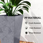 Close-up of tall gray tapered plastic planter with green plant leaves