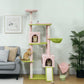 Pink cat tower with hanging toys, green hammock bed, and two entry condos