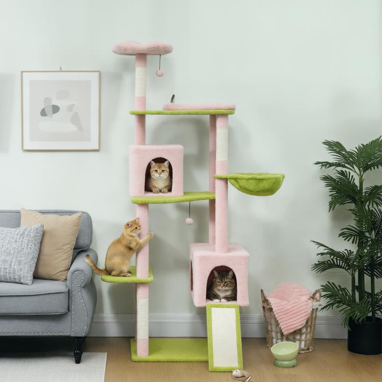 Pink cat tower with hanging toys, green hammock bed, and two entry condos