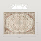 Flat lay of cream and mixed brown floral area rug with framed border and center medallion