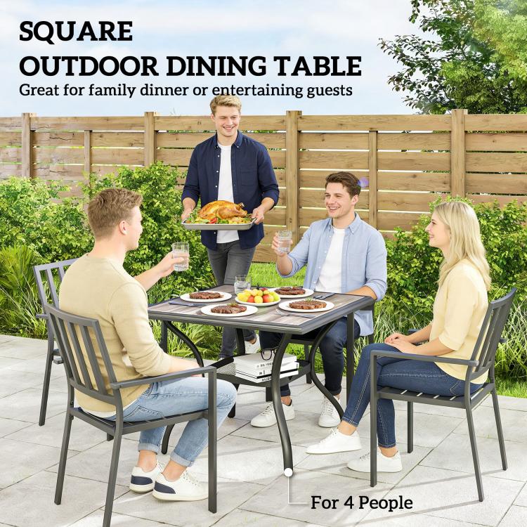 Square outdoor dining table with gray faux-wood top and umbrella hole, black frame