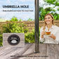 Umbrella hole detail on gray faux-wood tabletop with metal pole frame