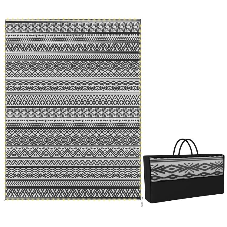 Outdoor rug carpet with black-and-white geometric pattern and matching carry bag