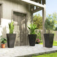 Stackable tall plant pots, dark speckled texture, set of 3 on a patio