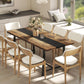 Brown industrial dining table with dark stripe and steel legs, with light upholstered chairs