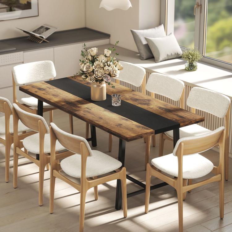 Brown industrial dining table with dark stripe and steel legs, with light upholstered chairs