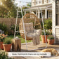 White A-frame steel stand with suspended egg chair in outdoor patio garden