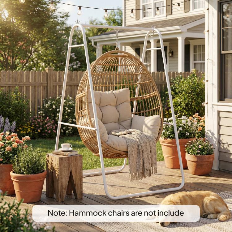 White A-frame steel stand with suspended egg chair in outdoor patio garden