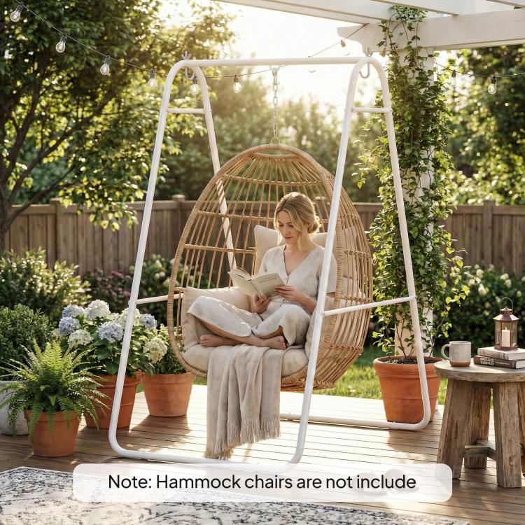 White A-frame steel stand with hanging egg chair, person reading while seated