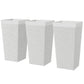 Three white stone-finish tapered outdoor planters with square tops, stackable set