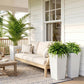 Three tall white stone-finish planters for outdoor patio decor