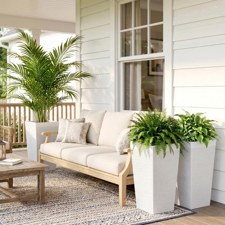 Three tall white stone-finish planters for outdoor patio decor