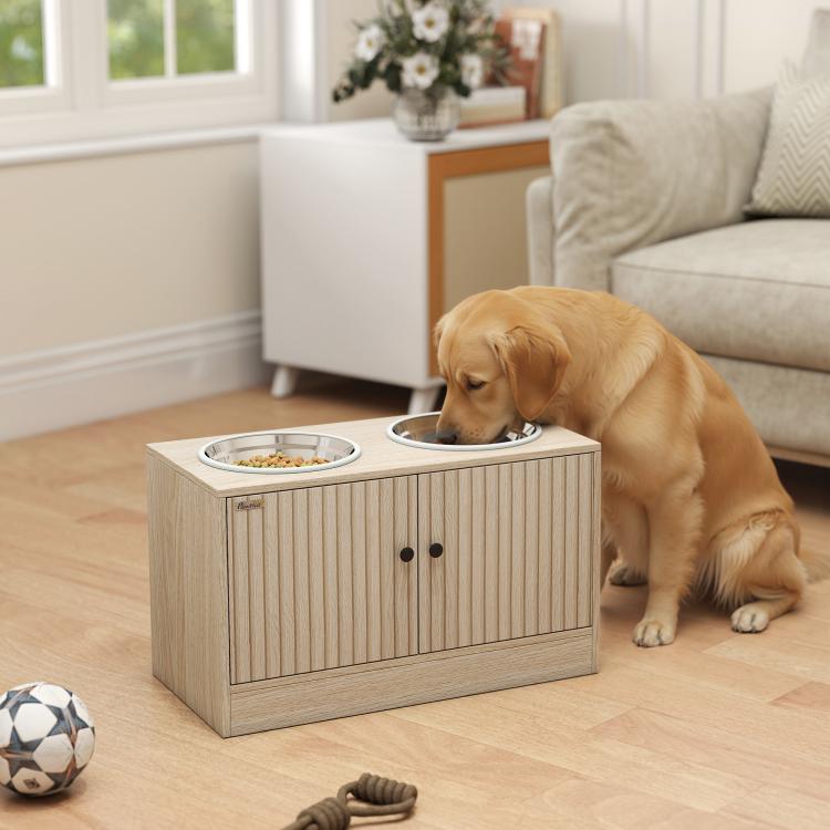Raised dog feeding cabinet with two bowls; golden retriever eating from front bowl