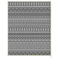 Reversible patio rug with black and white aztec-style pattern and fringe