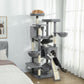 Multi-level cat tree with dark gray perches, top condo, and hanging hammock for cats.