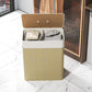 Natural beige fabric laundry hamper with hinged lid and rope handles, removable liner