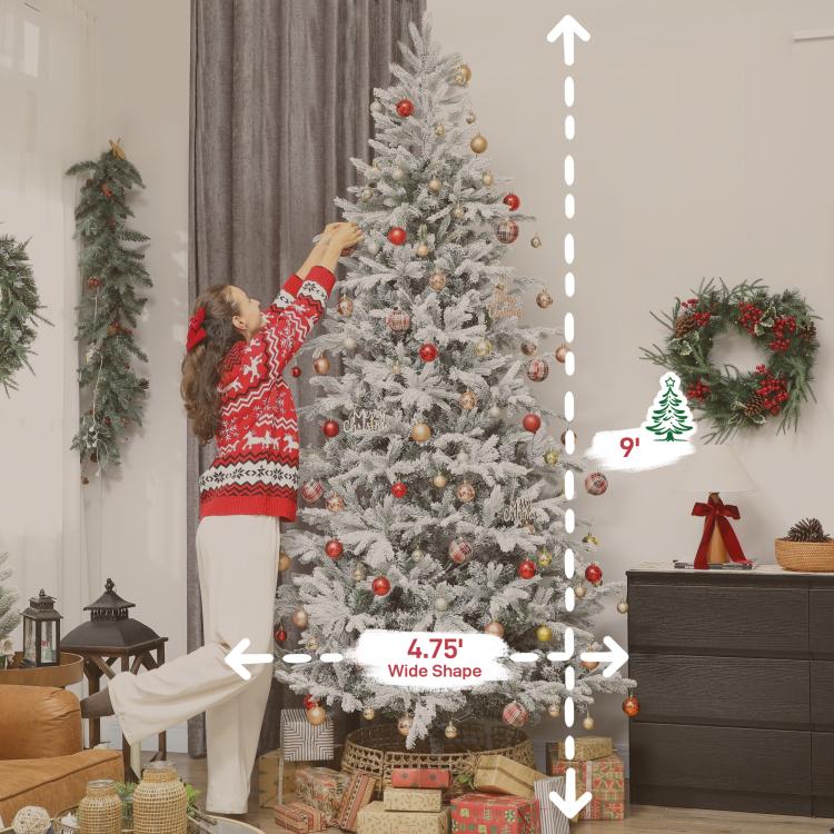 Frosted artificial Christmas tree decorated with red, gold, and silver ornaments