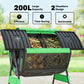 Outdoor dual-chamber tumbling compost bin with dual compartments visible through opening