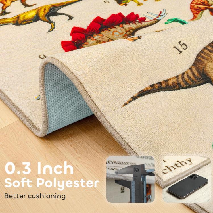 Khaki dinosaur play mat corner rolled up, showing soft edge and gray backing.