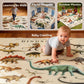 Baby crawling on khaki dinosaur play mat with colorful prehistoric illustrations.