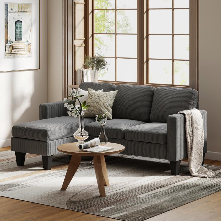 Dark gray sectional sofa with reversible chaise, thick cushions and supportive back.