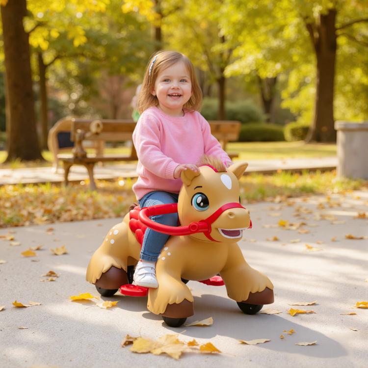 Toddler riding a tan and red electric rocking horse toy outdoors