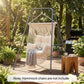 Gray hammock chair stand holding a macrame hammock chair outdoors