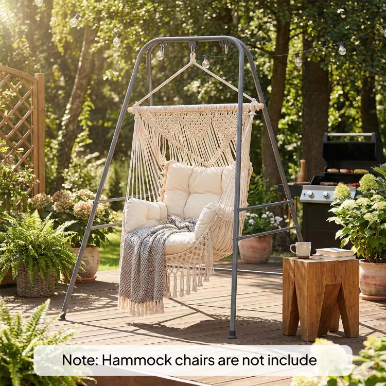 Gray hammock chair stand holding a macrame hammock chair outdoors