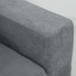 Dark gray textured sofa armrest and seat corner, rounded back cushions