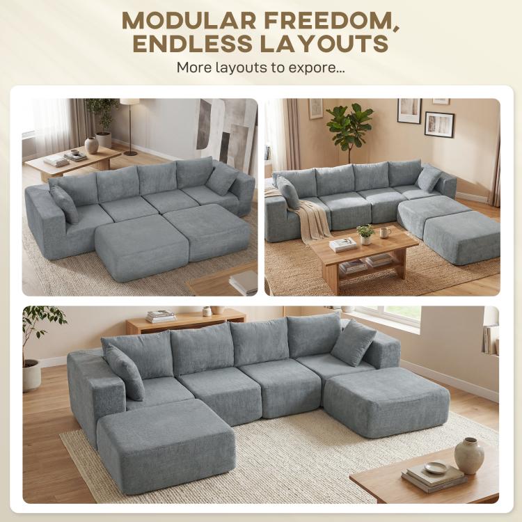 Dark gray modular sectional sofa with multiple layout sections and chaise ottoman