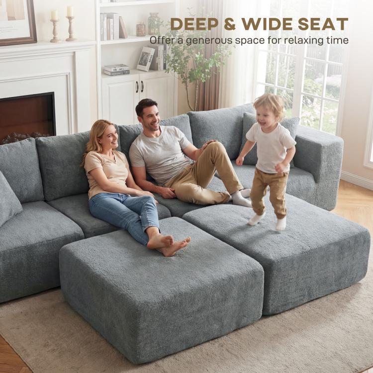 Dark gray deep and wide U-shaped sectional sofa with two ottoman seats and chaise
